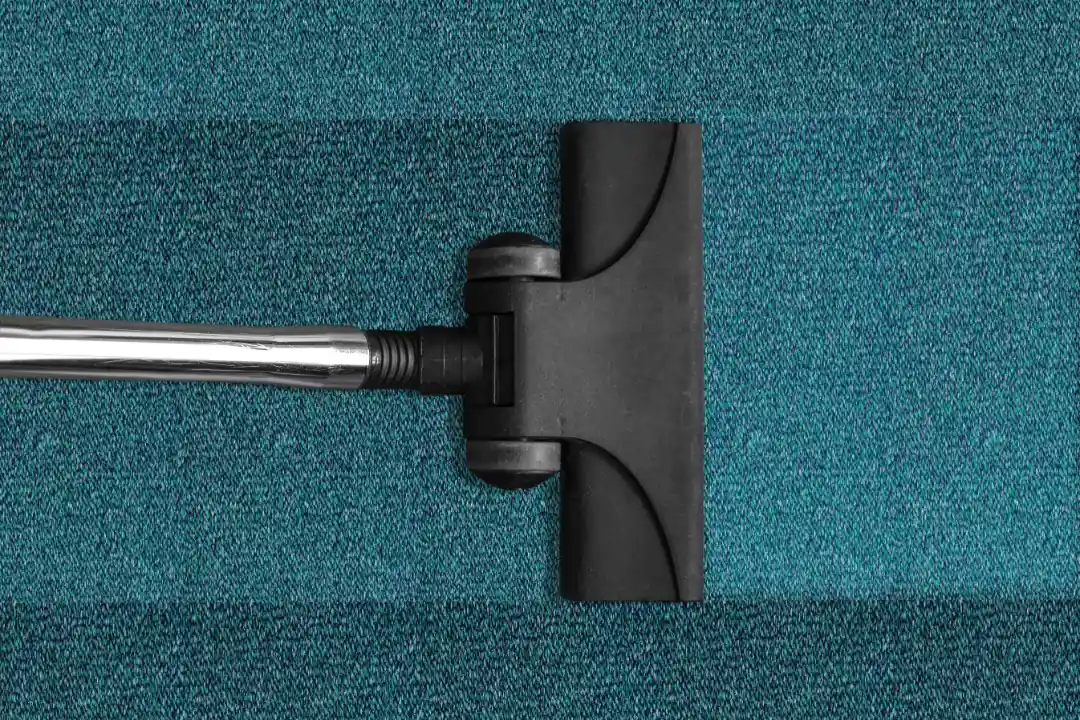 Vacuum cleaning teal carpet beo clean